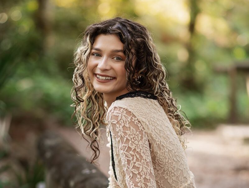 Senior portrait from a guided senior photography experience in Orlando, showing a relaxed and confident high school senior outdoors.