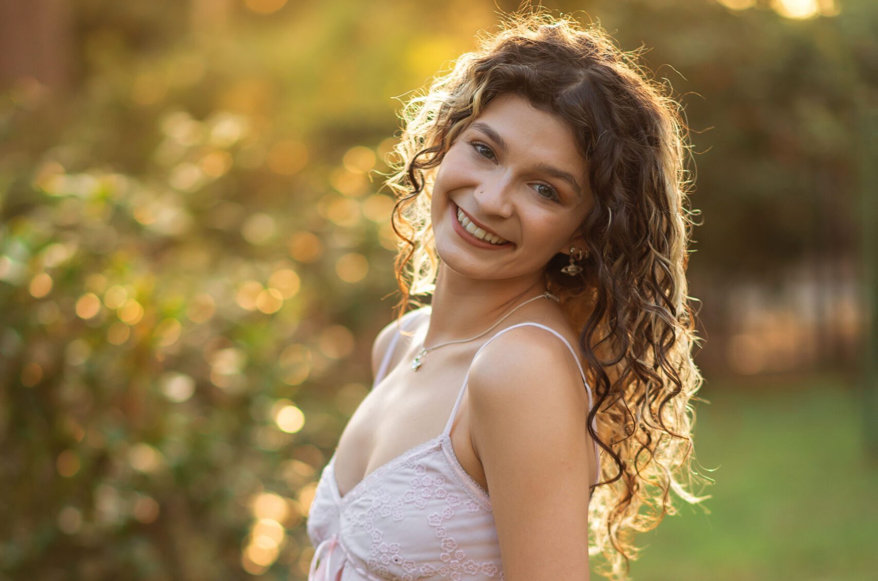 high school girl poses for senior pictures in orlando