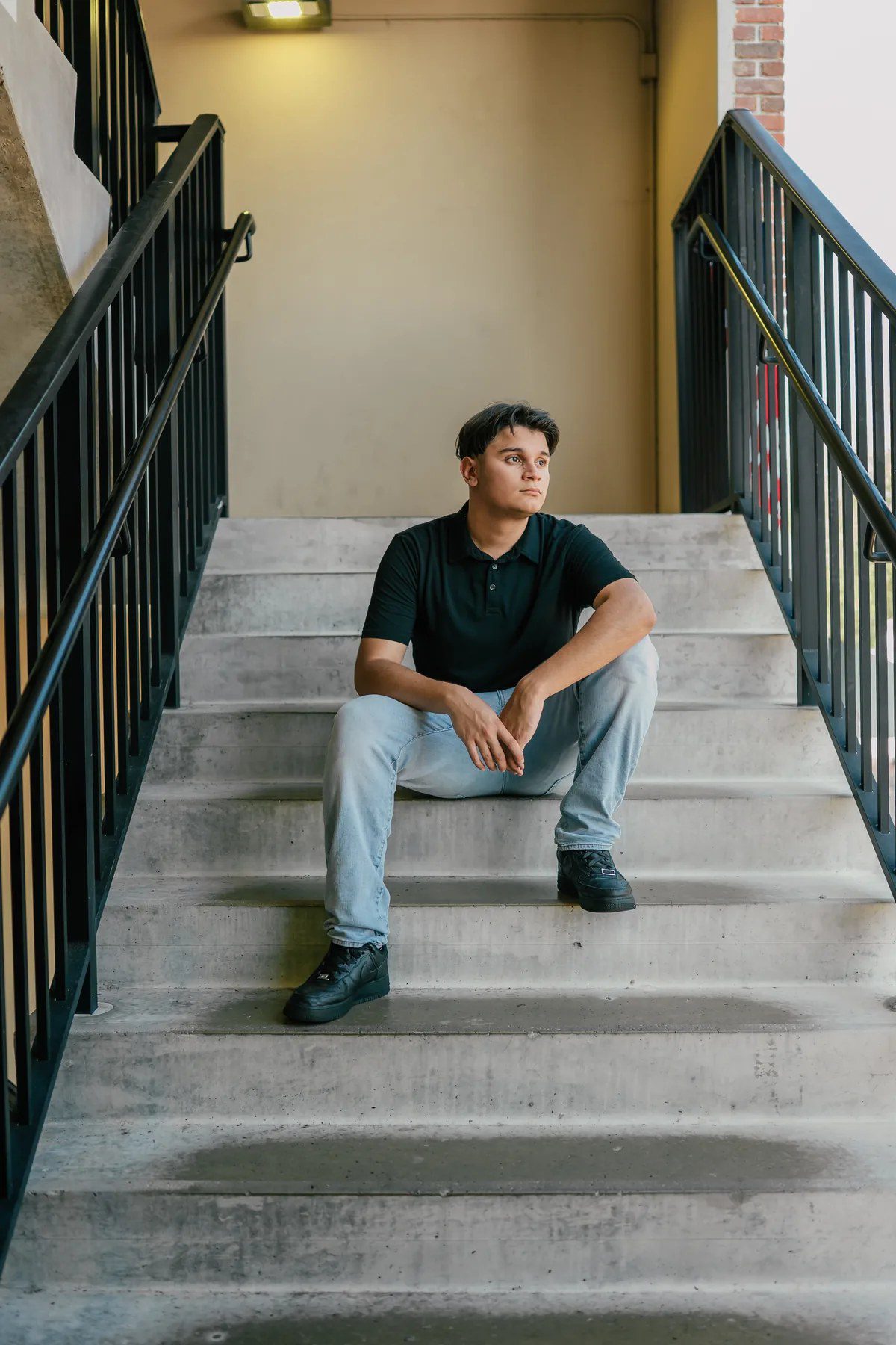 Downtown Winter Garden senior portrait seated on concrete steps