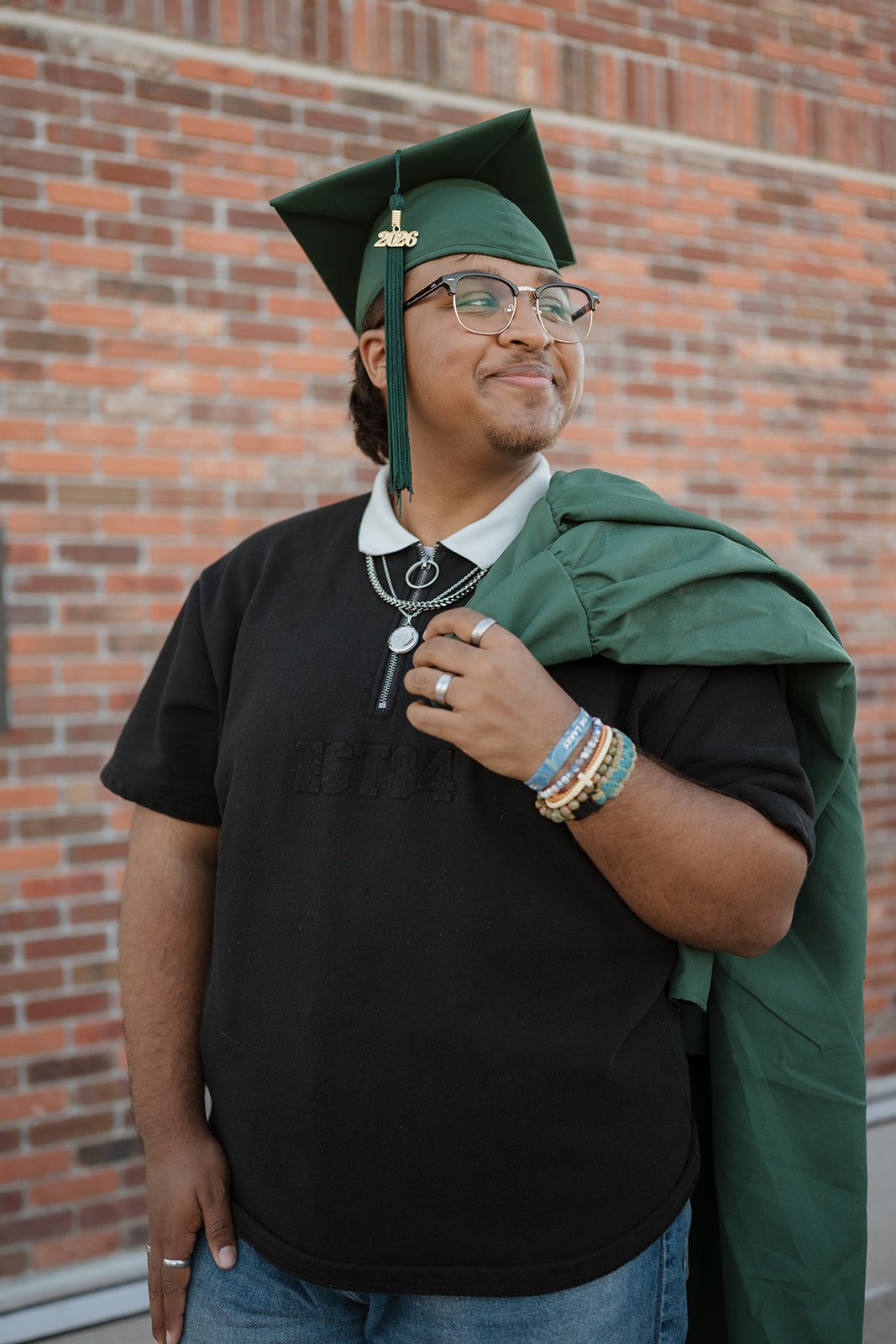 Senior wearing a cap and gown in Downtown Winter Garden