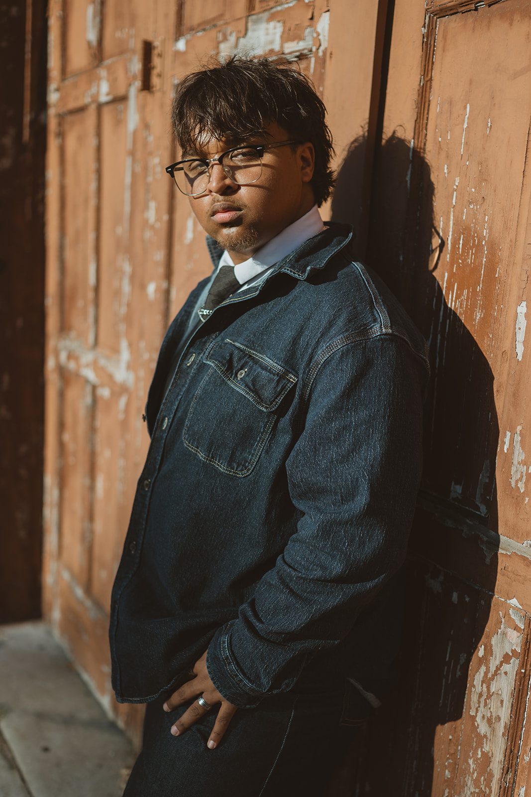 Creative editorial senior portrait featuring a denim outfit