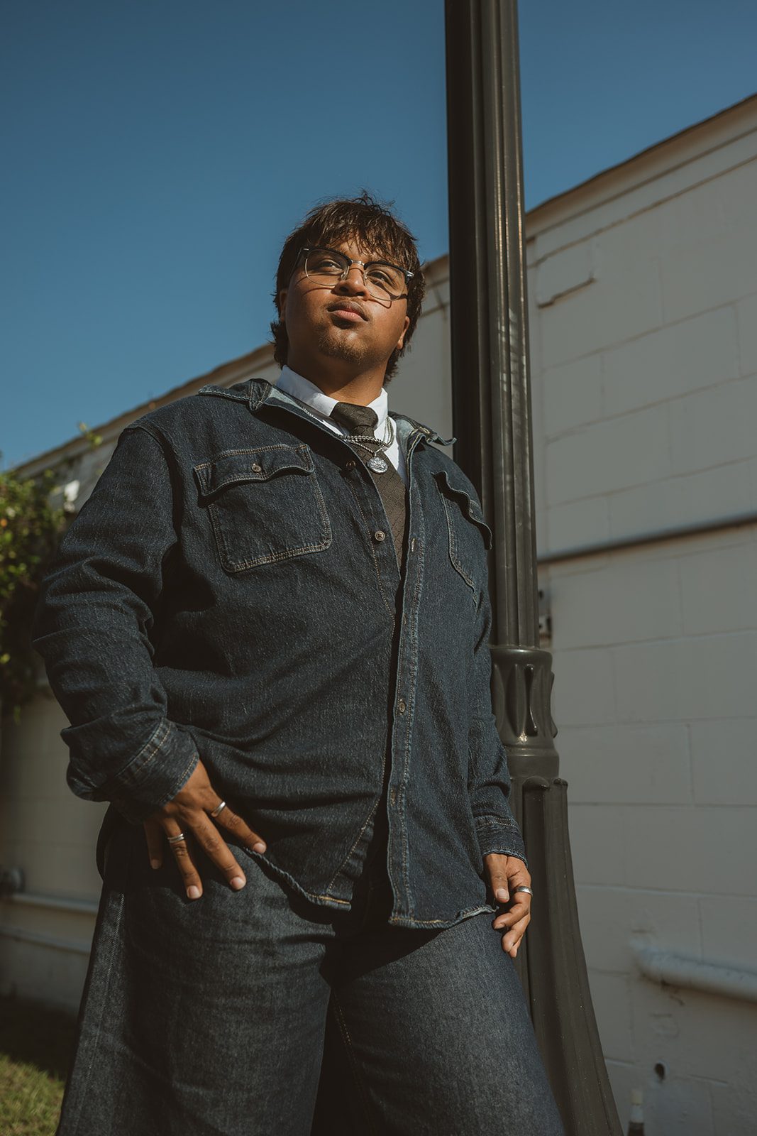 Senior guy walking through Downtown Winter Garden during an urban photo shoot