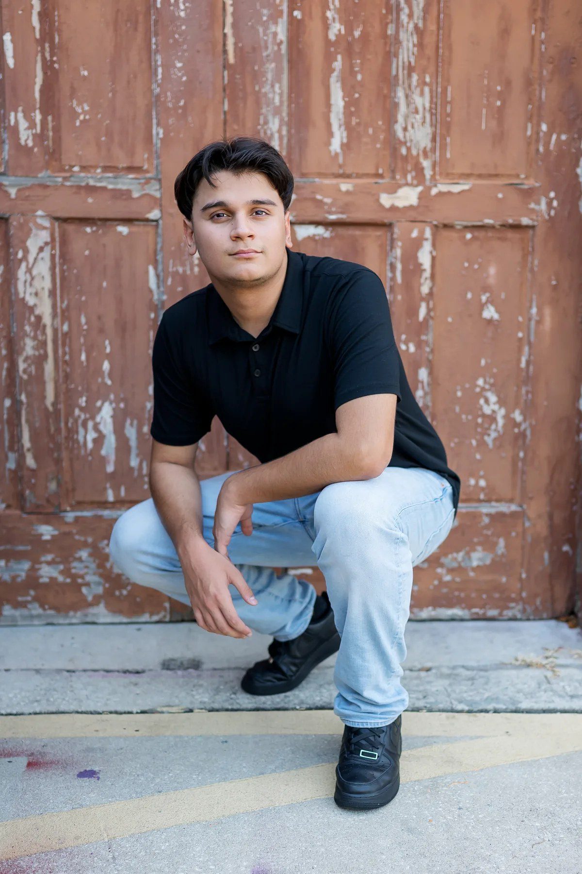 Downtown Winter Garden senior picture in front of a rustic door