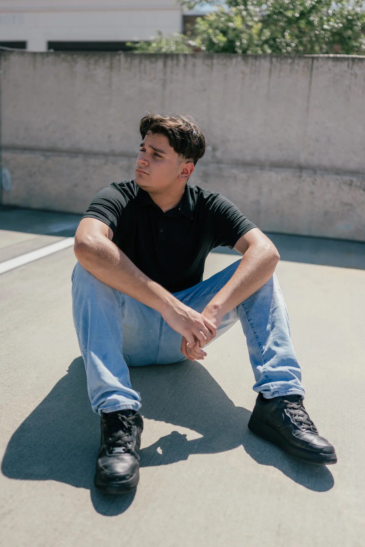 Rooftop parking garage senior portrait in Downtown Winter Garden