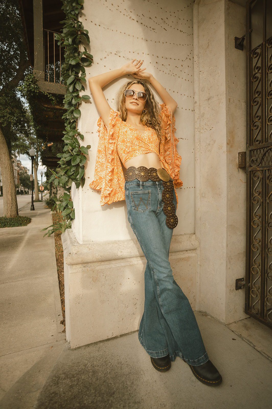 Vintage-inspired full-body portrait of Keeleigh posing beside an ivy-covered building in Winter Park.