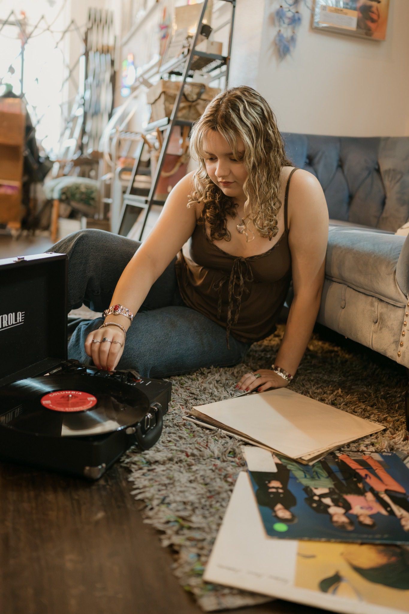 Senior listening to a record at a turntable during a Clermont senior session