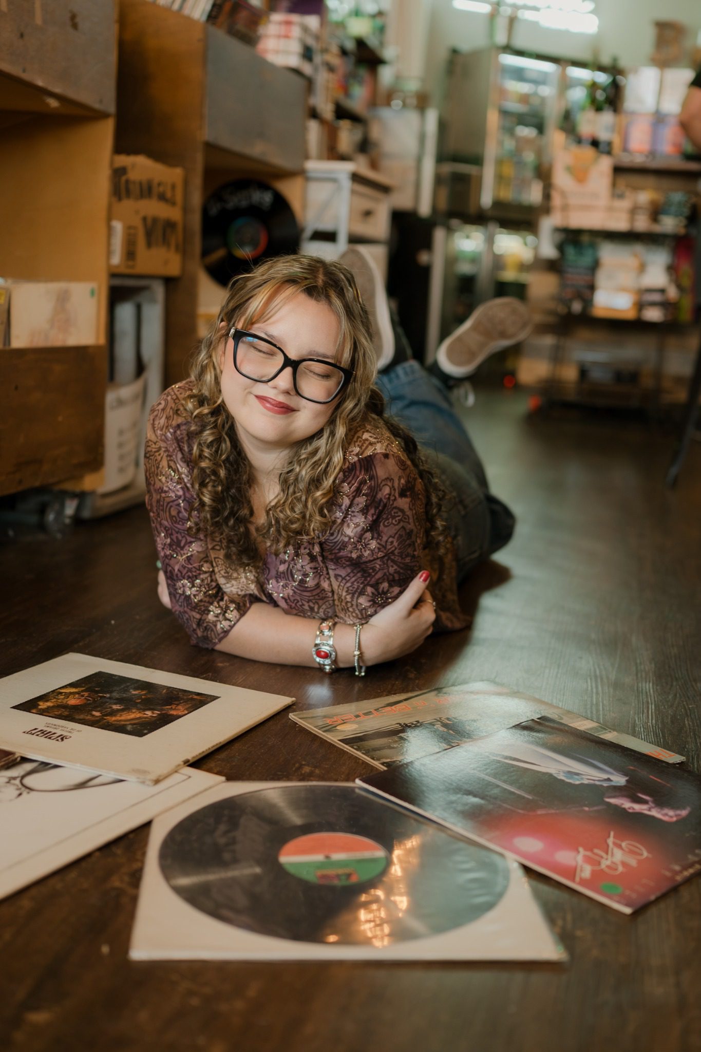 Senior holding a record inside a Clermont, Florida record store