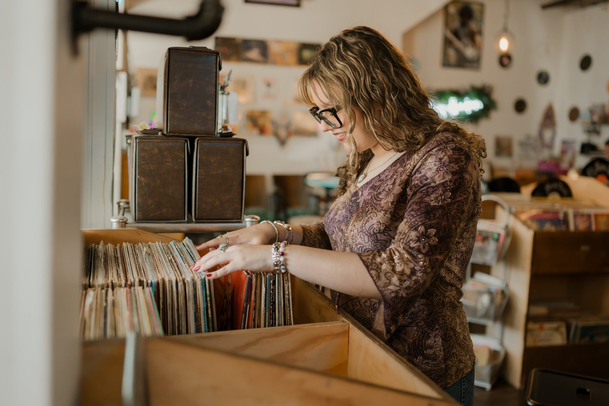 Senior browsing vinyl records inside a record store in Clermont, Florida, near Orlando