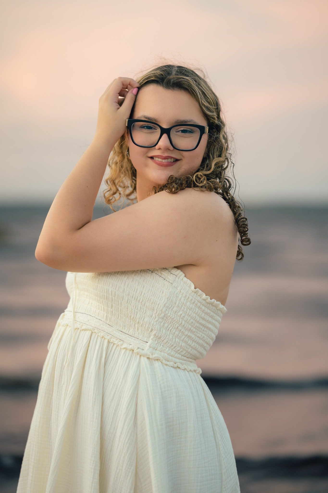 Close senior portrait beneath an evening sky at Lake Louisa near Orlando