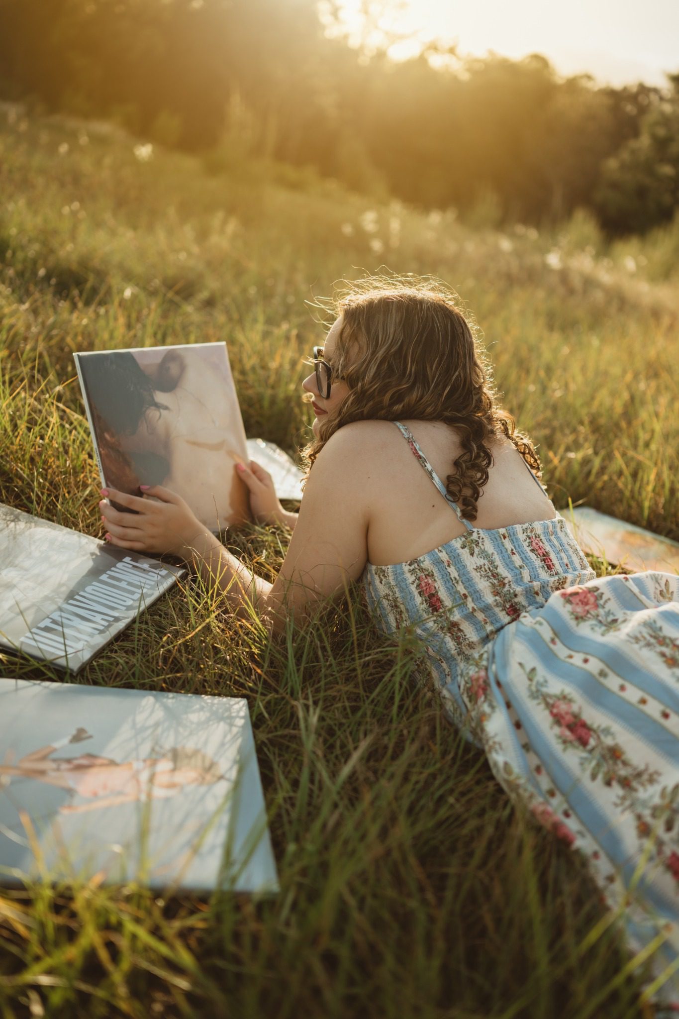 Vinyl records arranged in the grass during a Clermont senior photo session